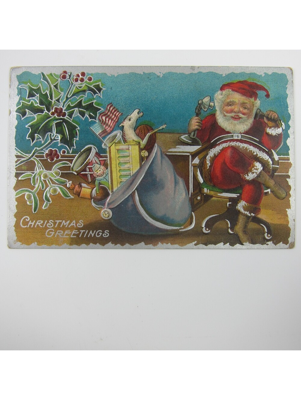Christmas Postcard Santa on Telephone Bag of Toys Silver Embossed Antique 1910